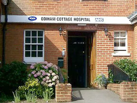 The red-brick entrance of Odiham Cottage Hospital, with its sign over the door
