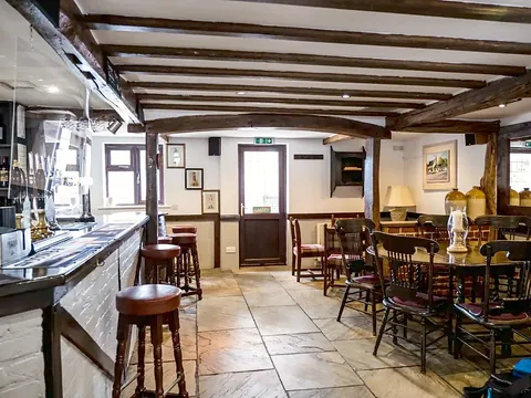 The beamed bar and dining area inside the Derby Inn