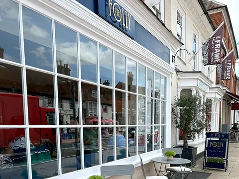 The Folly Coffee Bar on Odiham High Street, with tables and chairs outside its big windows